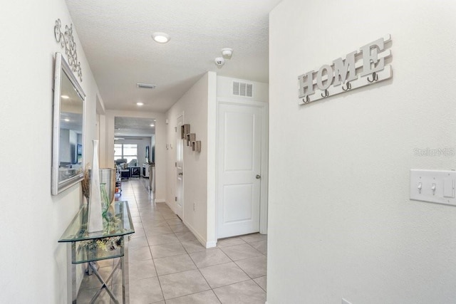 hallway with light tile patterned flooring