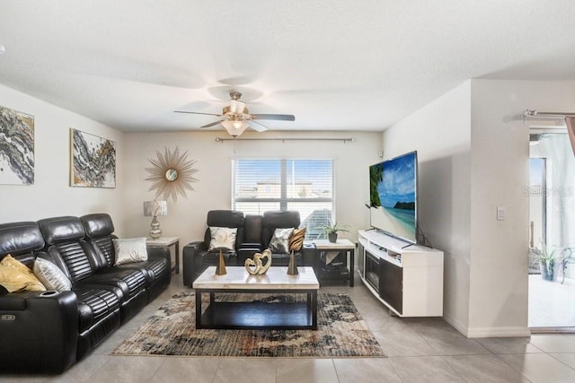 living room with light tile patterned flooring and ceiling fan