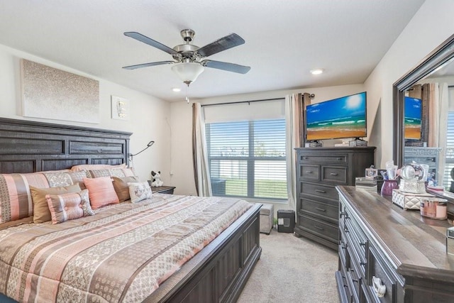 bedroom with light colored carpet and ceiling fan