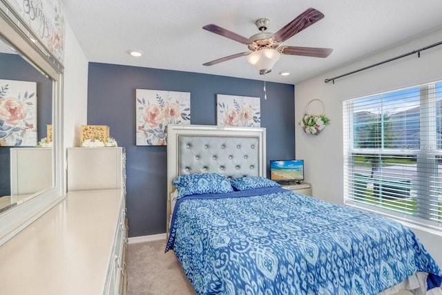 carpeted bedroom with ceiling fan