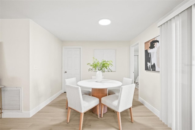 dining area with light hardwood / wood-style flooring