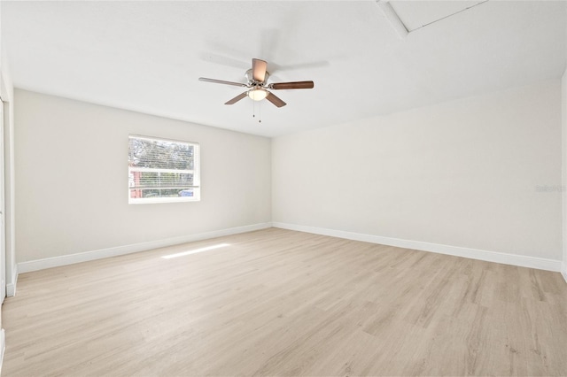 spare room featuring light hardwood / wood-style floors and ceiling fan