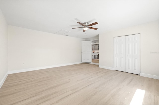 unfurnished bedroom with a closet, ceiling fan, and light hardwood / wood-style floors