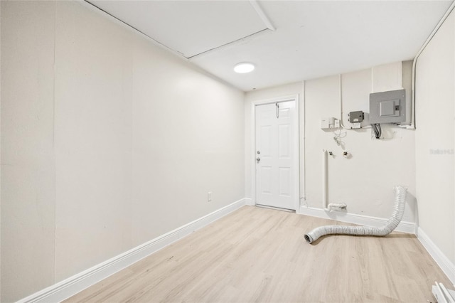 interior space with light hardwood / wood-style flooring and electric panel