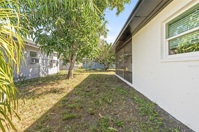 view of yard with a sunroom