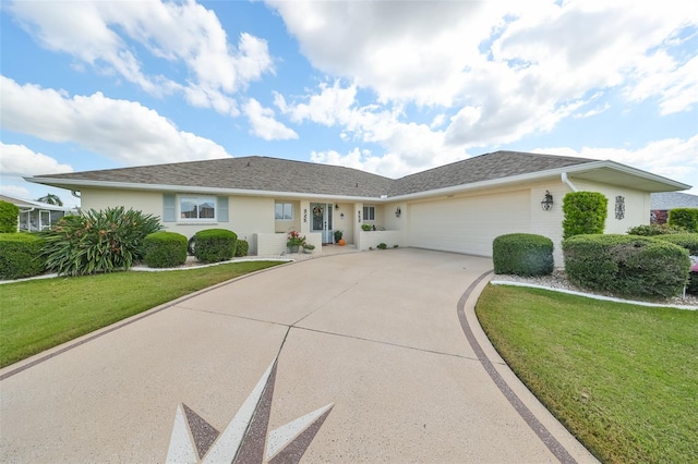 ranch-style home featuring a garage and a front lawn