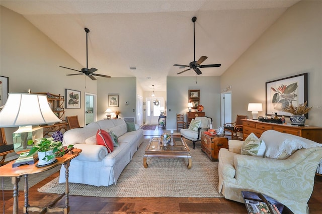 living room featuring ceiling fan, high vaulted ceiling, and wood-type flooring