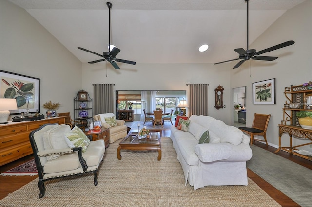 living room with high vaulted ceiling, light hardwood / wood-style flooring, and ceiling fan