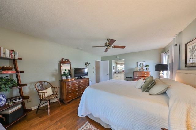 bedroom featuring ceiling fan, dark hardwood / wood-style floors, and a textured ceiling