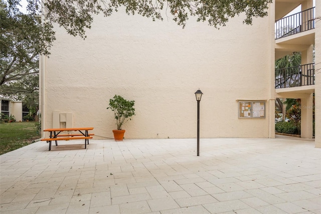 view of patio / terrace with a balcony