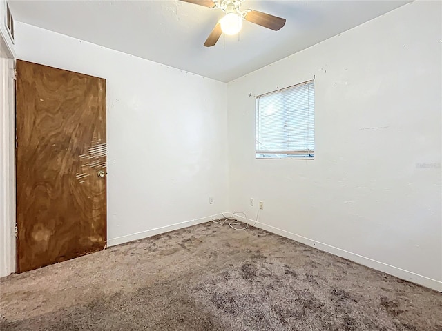 unfurnished room featuring carpet and ceiling fan