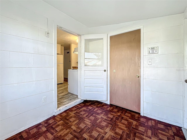 interior space with dark parquet flooring