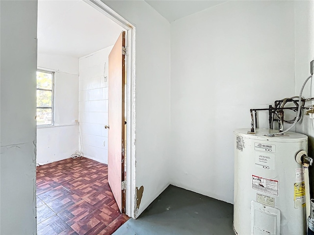 utility room with electric water heater