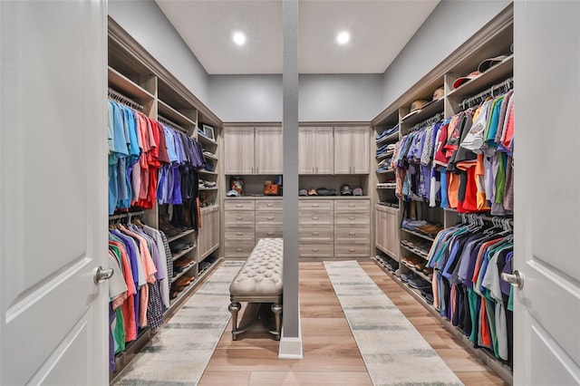 walk in closet featuring light hardwood / wood-style floors