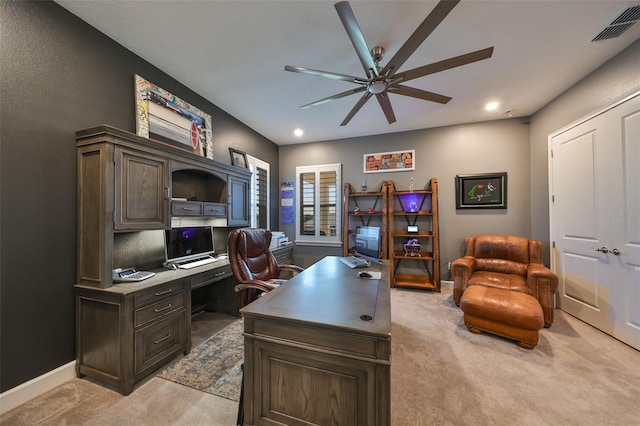 office area featuring light carpet and ceiling fan