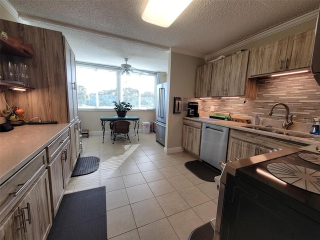 kitchen with tasteful backsplash, appliances with stainless steel finishes, ornamental molding, light tile patterned flooring, and sink