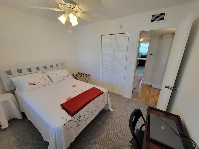 bedroom featuring hardwood / wood-style flooring, a closet, and ceiling fan