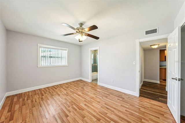 unfurnished room with ceiling fan and light hardwood / wood-style flooring