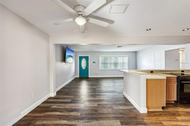 kitchen featuring dark hardwood / wood-style flooring, black range with electric stovetop, and ceiling fan