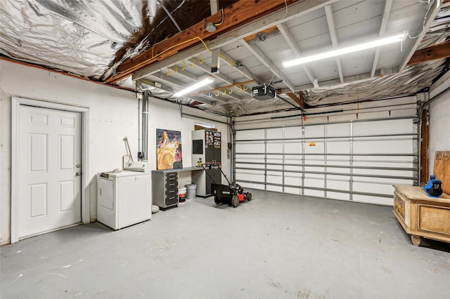 garage with washer / dryer and a garage door opener