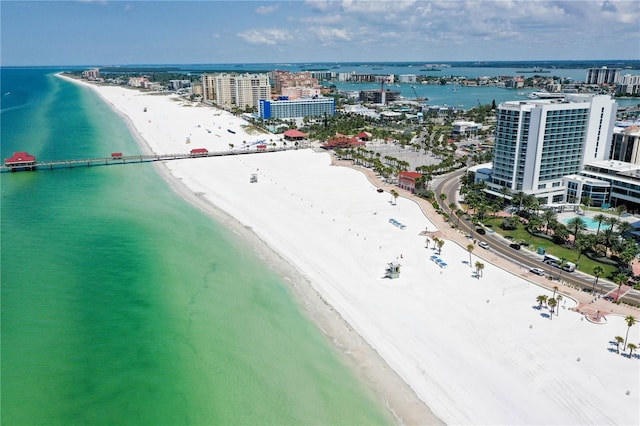 birds eye view of property featuring a view of the beach and a water view