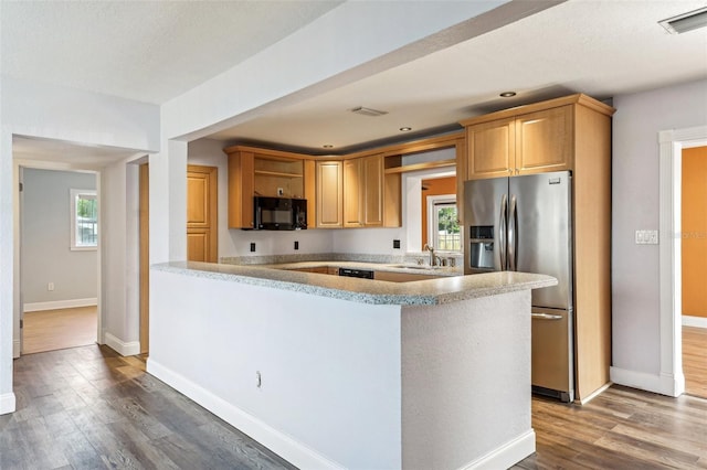 kitchen with light brown cabinetry, dark hardwood / wood-style flooring, stainless steel refrigerator with ice dispenser, and sink