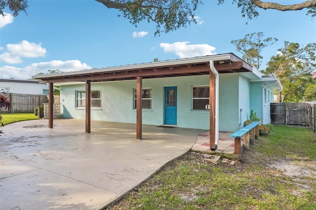 back of house featuring a patio