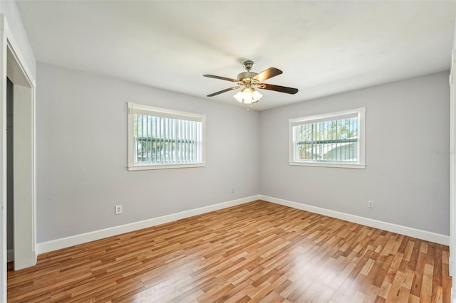 unfurnished room with ceiling fan, plenty of natural light, and light hardwood / wood-style floors