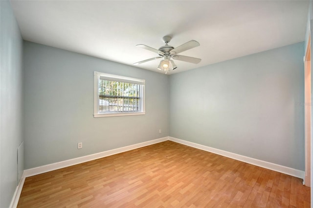 empty room with ceiling fan and light wood-type flooring