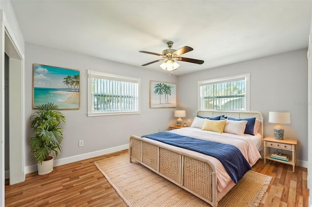 bedroom featuring hardwood / wood-style floors and ceiling fan