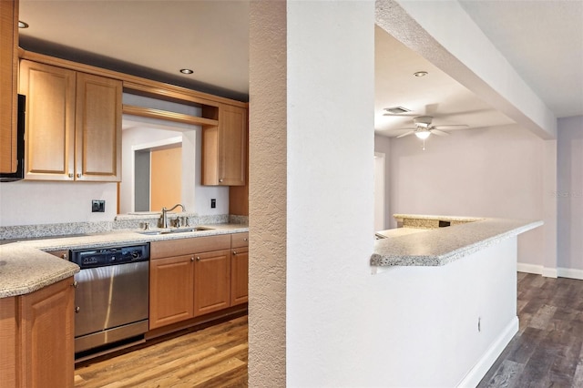 kitchen with kitchen peninsula, stainless steel dishwasher, ceiling fan, dark wood-type flooring, and sink