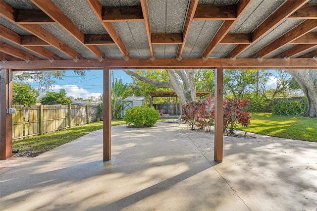 view of patio featuring a storage shed