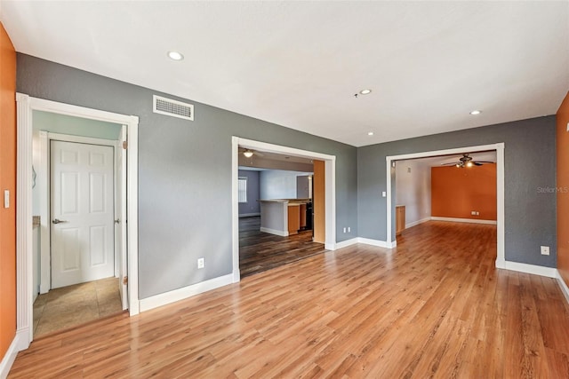 unfurnished living room featuring light wood-type flooring