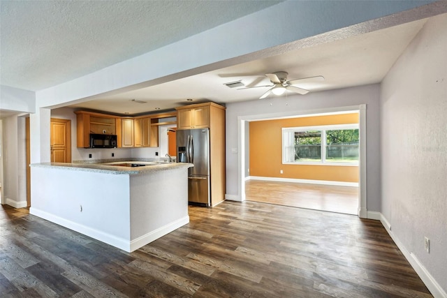 kitchen featuring a textured ceiling, dark hardwood / wood-style flooring, kitchen peninsula, and stainless steel refrigerator with ice dispenser