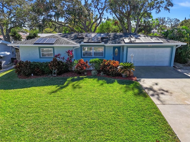 single story home featuring a front yard and a garage