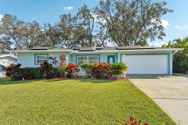 ranch-style home with a front yard and a garage