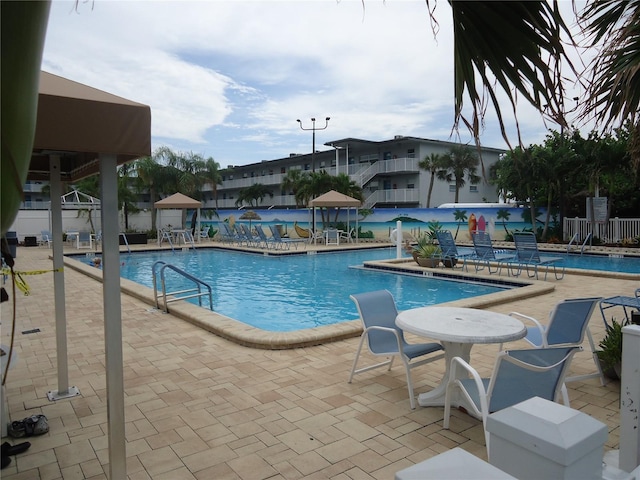 view of swimming pool featuring a patio