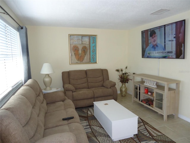 living room with light tile patterned floors