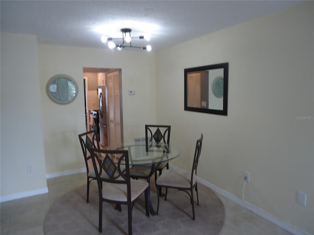 dining room with a textured ceiling