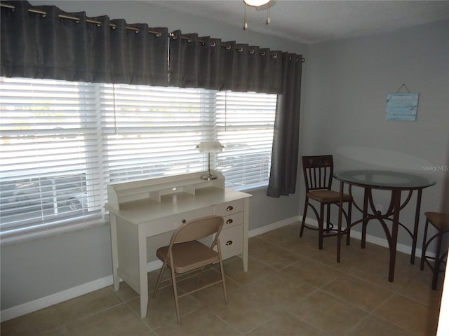 office space with light tile patterned floors