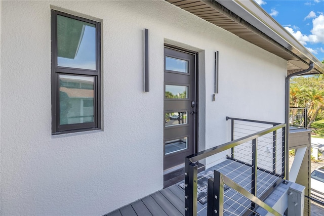 doorway to property featuring a balcony