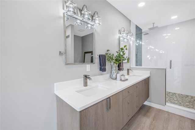 bathroom with vanity, hardwood / wood-style floors, and an enclosed shower