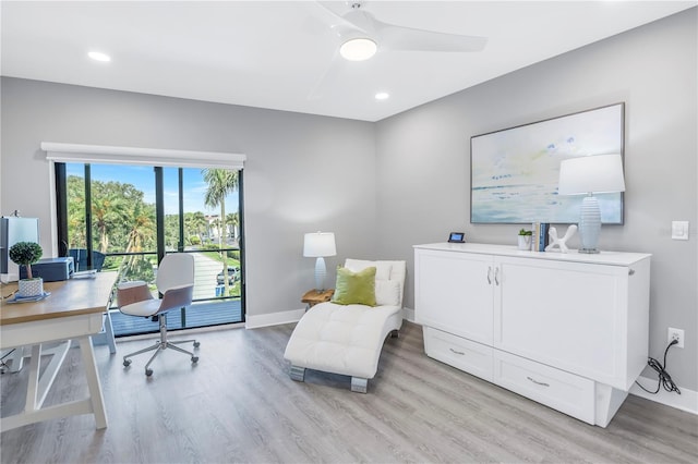 office space featuring light hardwood / wood-style floors and ceiling fan