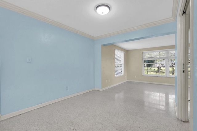 spare room featuring ornamental molding