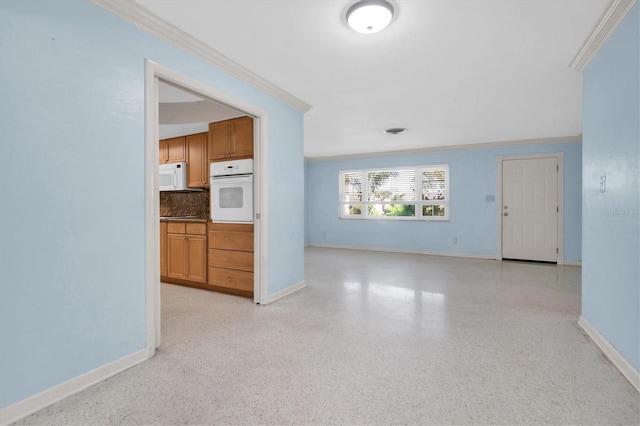 unfurnished living room featuring crown molding