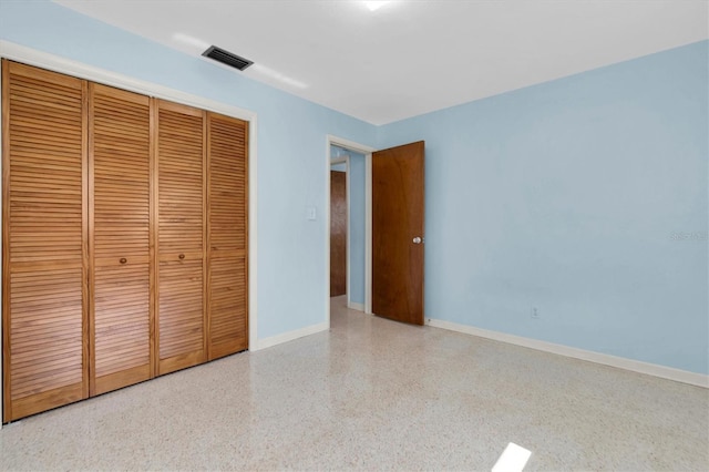 unfurnished bedroom featuring a closet