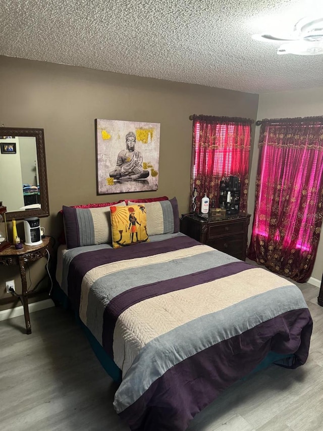 111 Carillo St NE, Palm Bay, FL 32907 - bedroom with a textured ceiling and wood finished floors