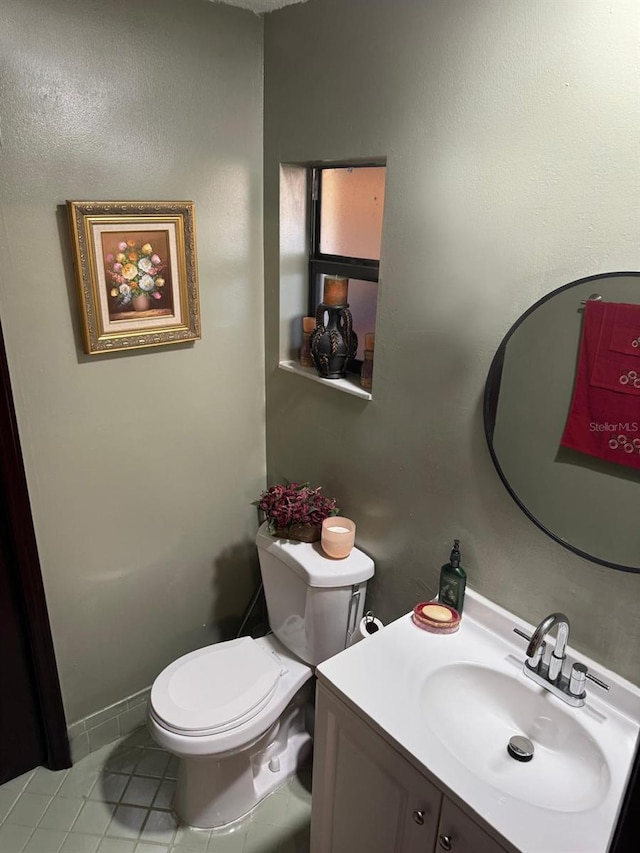 111 Carillo St NE, Palm Bay, FL 32907 - bathroom featuring toilet, tile patterned floors, and vanity