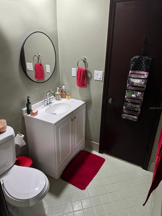 111 Carillo St NE, Palm Bay, FL 32907 - bathroom with vanity, toilet, and tile patterned floors