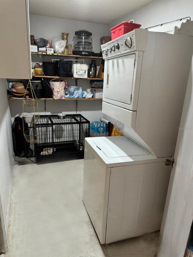 111 Carillo St NE, Palm Bay, FL 32907 - laundry room featuring stacked washer / dryer
